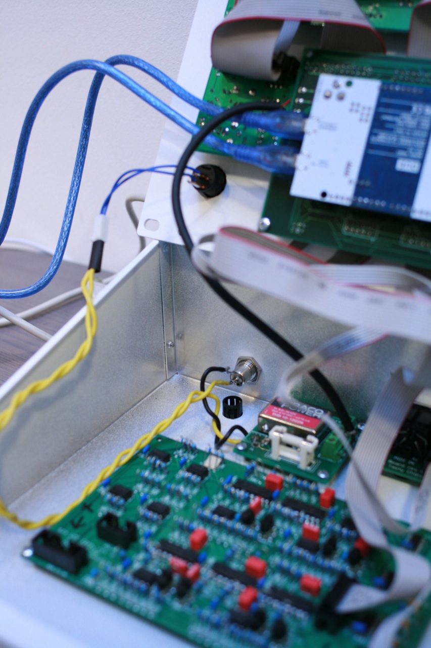 VCF and power PCB's fastened on the bottom and the power leads running from 2.1 barrel socket to the rocker switch on to the power board.