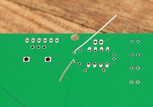 The inserted diode seen from the bottom of the PCB. The legs are bent so that it remains in place.